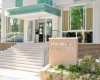 Vstup do moderného hotela s nápisom Hotel Calypso a štyrmi hviezdičkami.